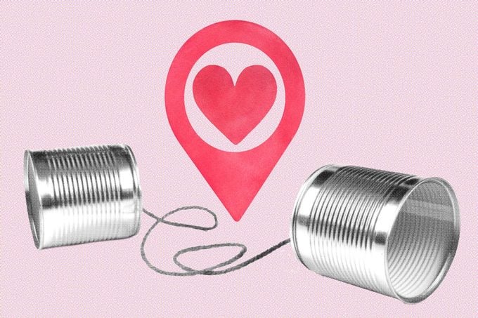 tin can phone with a map marker with a heart in the middle of the string