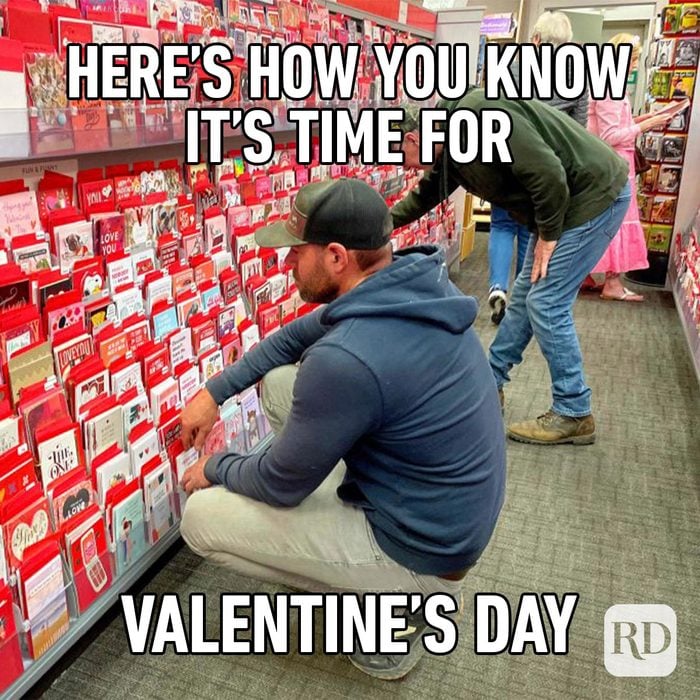 Funny Valentines Day Memes Everyone Can Relate To men buying gifts from an aisle filled with red coloured and heart shaped gifts meme with copy "Here's how you know it's time for Valentine's Day"