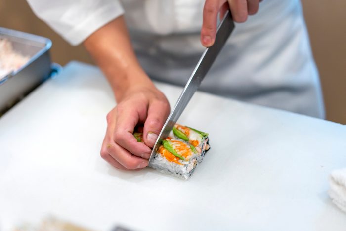 Chef preparing maki sushi