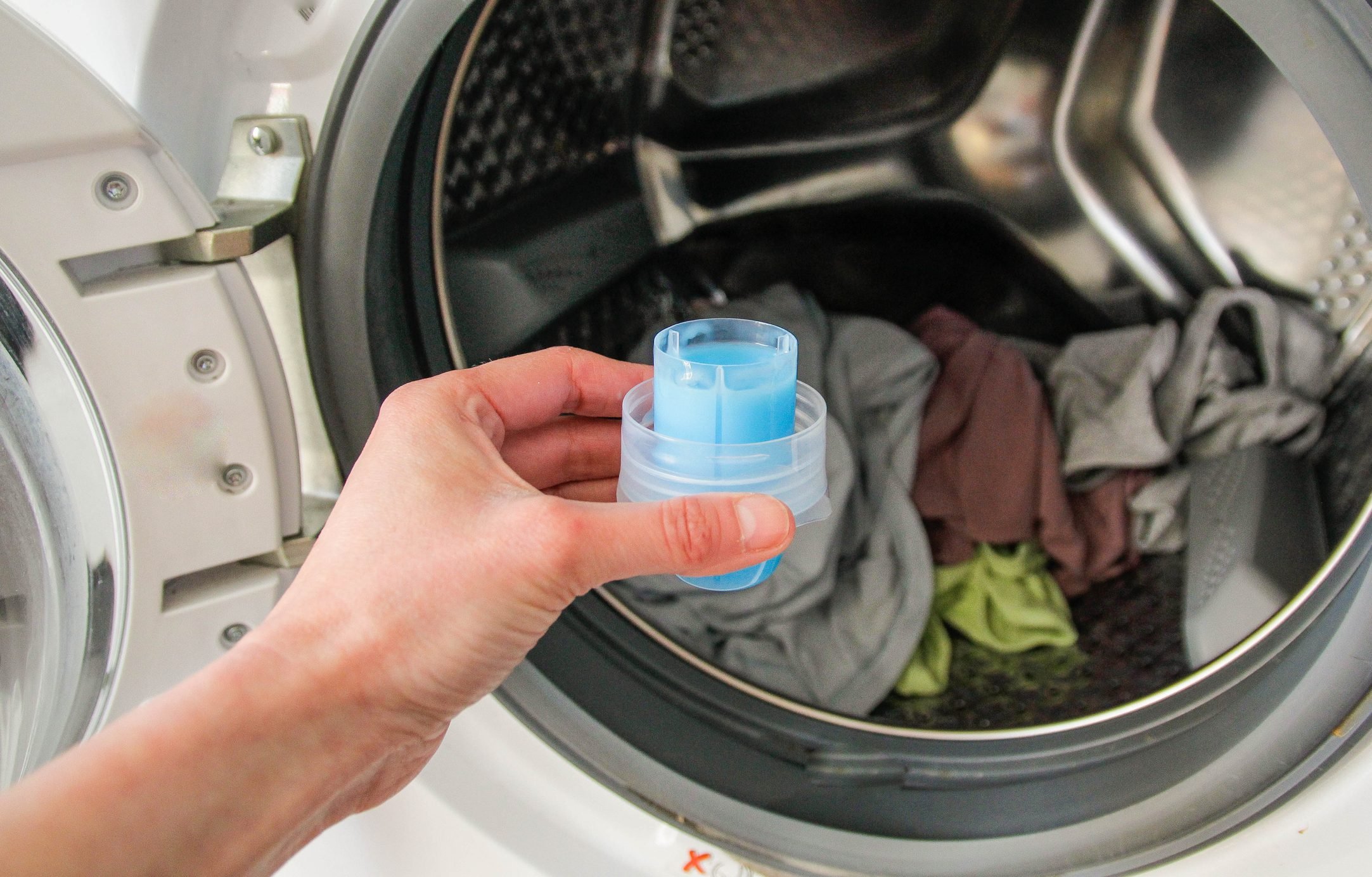 measuring cup of liquid laundry detergent