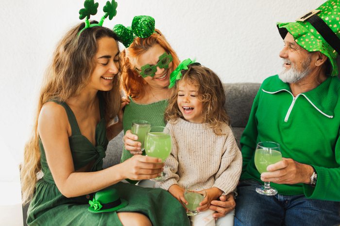 Happy family celebrating St. Patrick's Day.