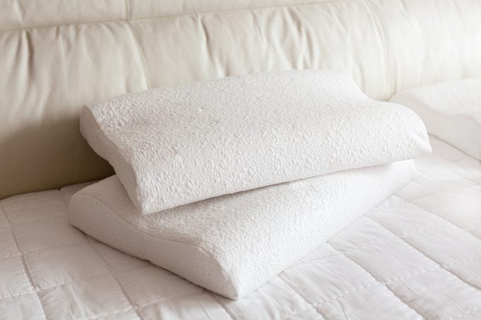 foam pillow on bed in sunshine