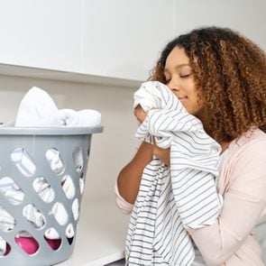 woman smelling laundry