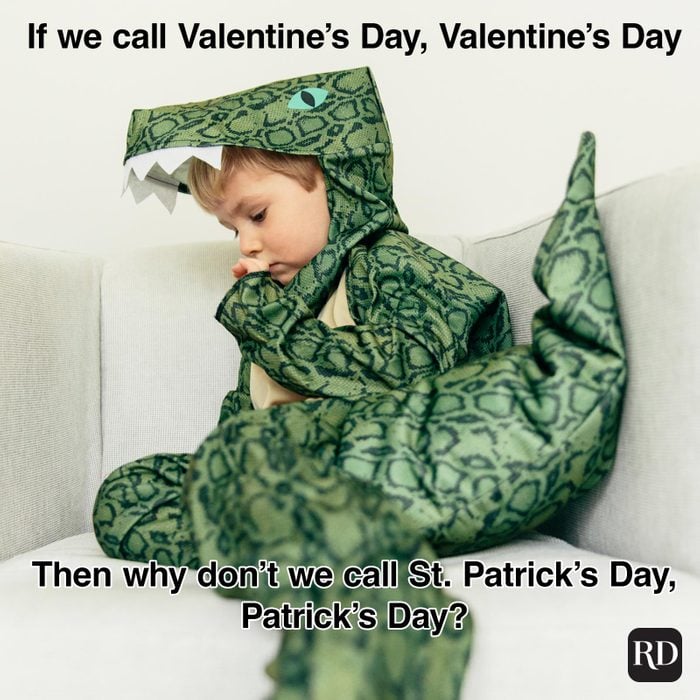 St. Patrick’s Day Meme of a child wearing a dinosaur costume in deep thought.