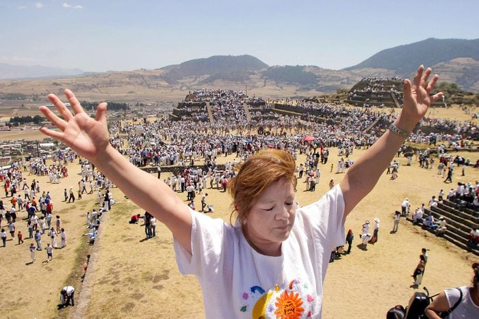 A Woman Raises Her Hands To Receive The Energy From The Sun During The Celebration Of The Spring Solstice At The Teotenengo Archaeological Site