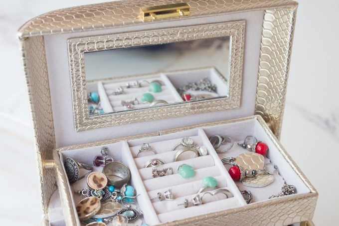 luxurious casket with drawers and silver jewelry, precious stones, pearls.