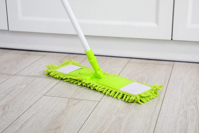 green mop on kitchen floor
