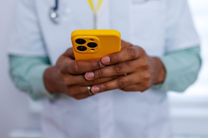Surgeon staying connected with smartphone