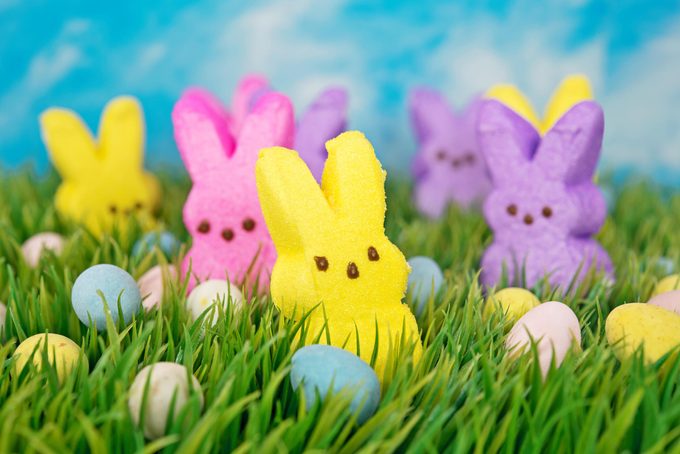 bunny peeps and chocolate eggs in green grass