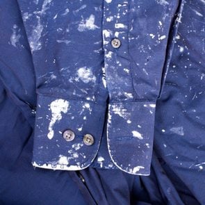 navy blue shirt stained with white paint