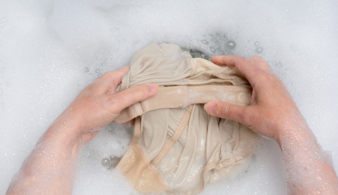 Woman pov handwashing clothing