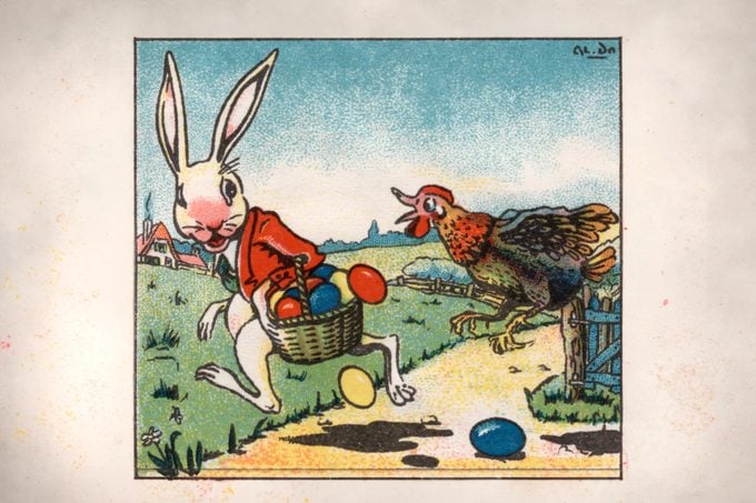 vintage illustration of easter bunny with easter eggs in a basket