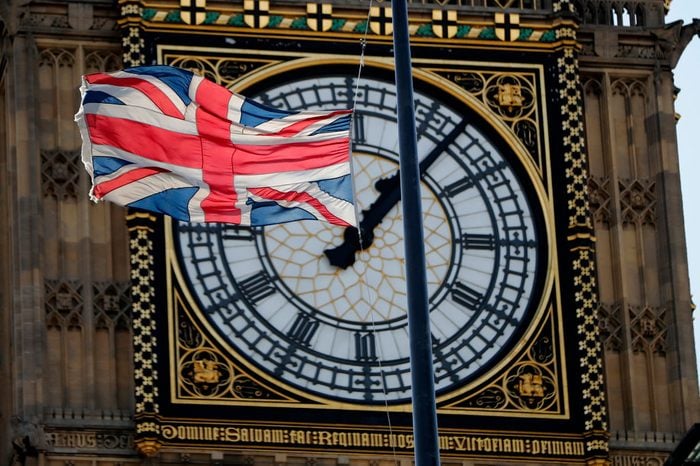 clock and england flag half mast