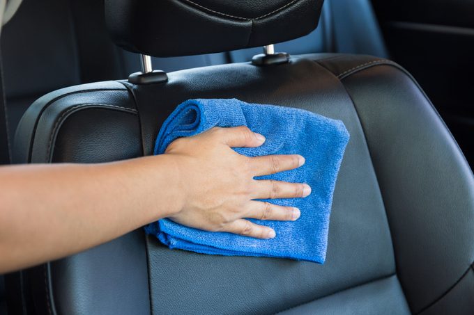 Hand With Microfiber Cloth Cleaning Interior Modern Car Seat