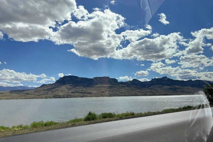 A view of river and mountains from a car
