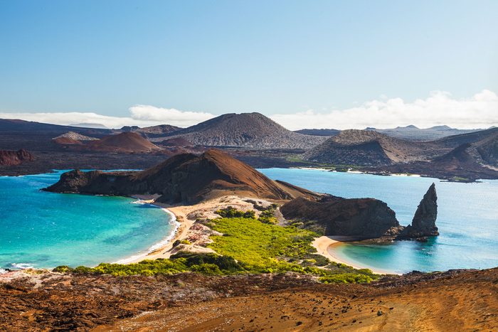 View On The Volcanic Landscape Of Bartolome Island With Famous Pinnacle Rock And Golden Beach Galapagos Islands Ecuador