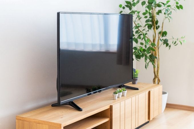 A Tv In A Living Room Of Modern Apartment