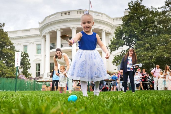 A Four Year Old Girl Rolls An Colored Egg Down The White House South Lawn During Easter Egg Roll