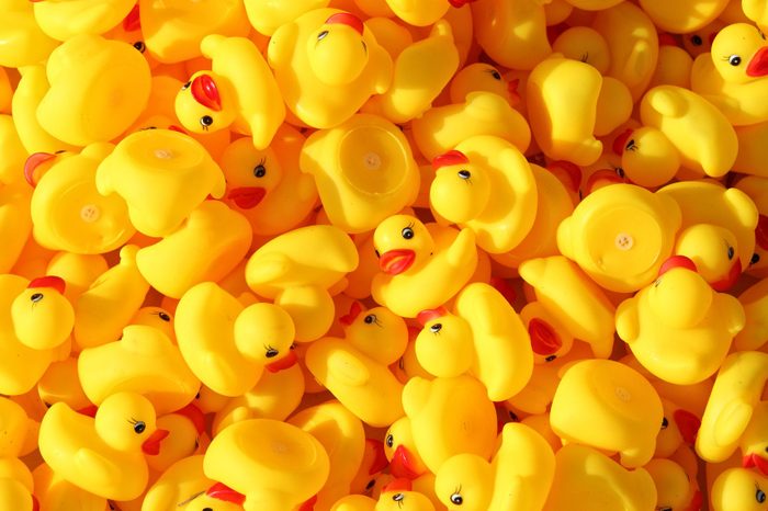 large group of yellow rubber toy ducks