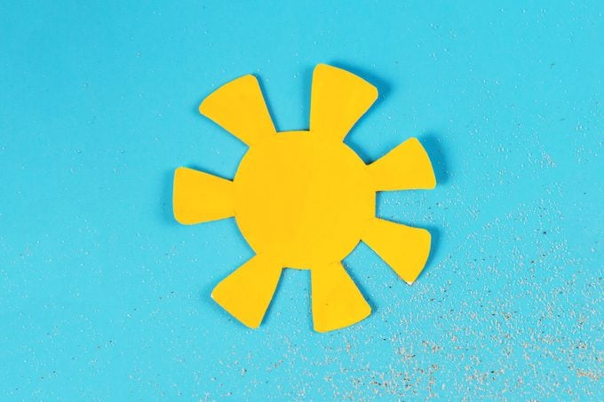 paper sun on a blue background