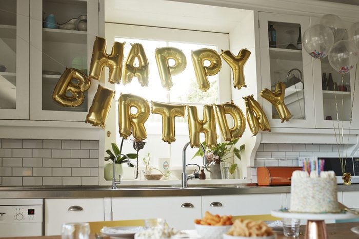 Happy birthday text in kitchen at home