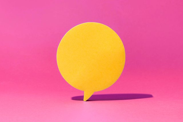 yellow speech bubble on a pink background