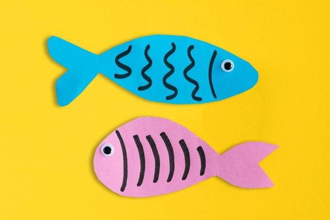 paper fish on yellow background