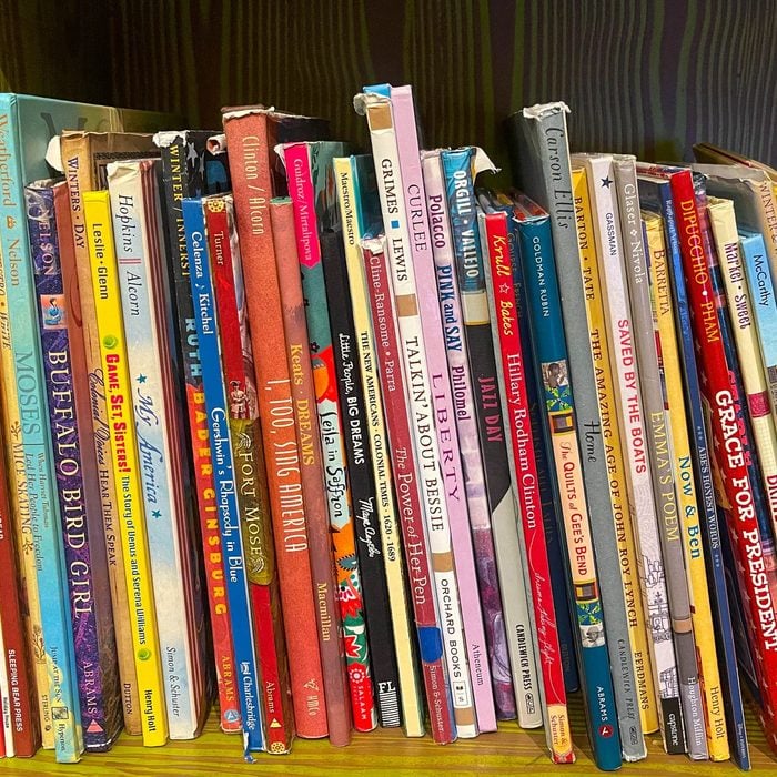Many childrens books on bookcase