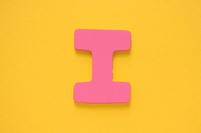 pink letter "I" on a yellow background