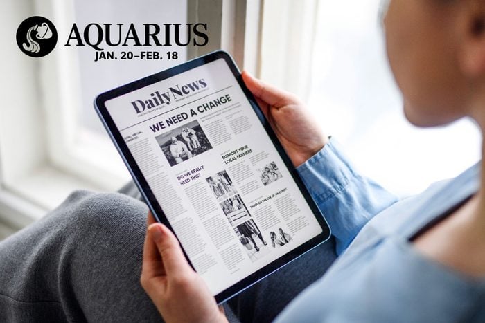 reading the news on an ipad with aquarius zodiac in upper left corner