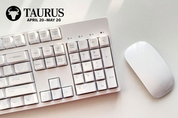 copmuter keyboard and mouse with taurus zodiac in upper left corner