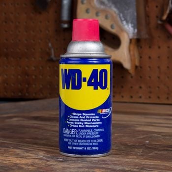 wd-40 bottle in a garage workshop environment