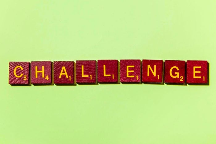 "CHALLENGE" in scrabble letters on a green background