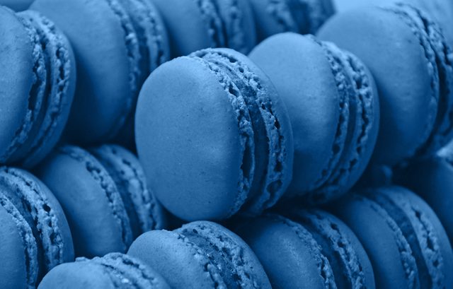 Fresh baked blue macaroon cookies close up