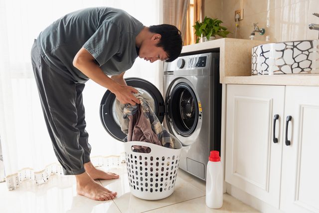 man doing his own laundry