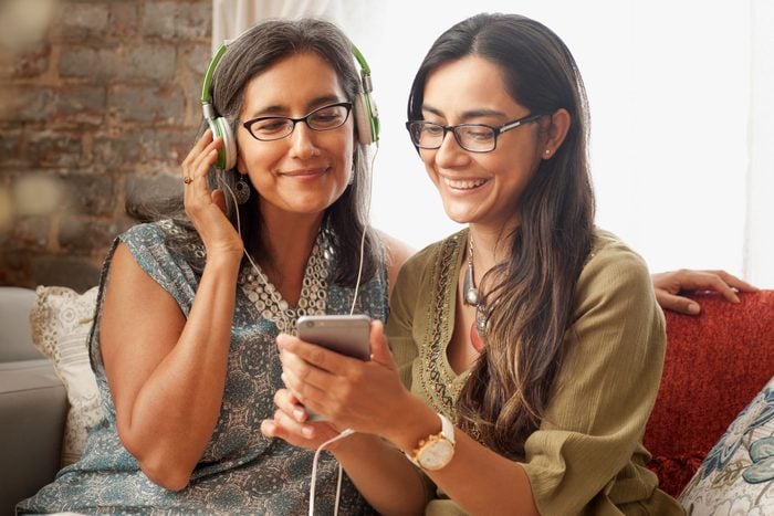 mother and daughter listening to music