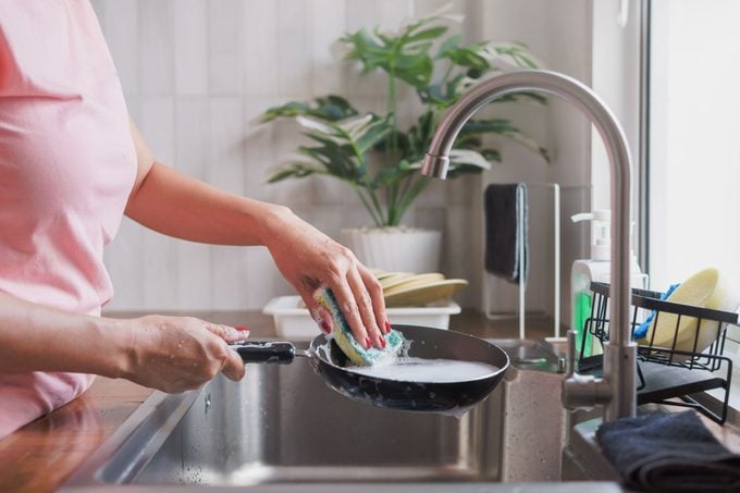 Woman Using Cleaning Sponge Clean Cooking Pan